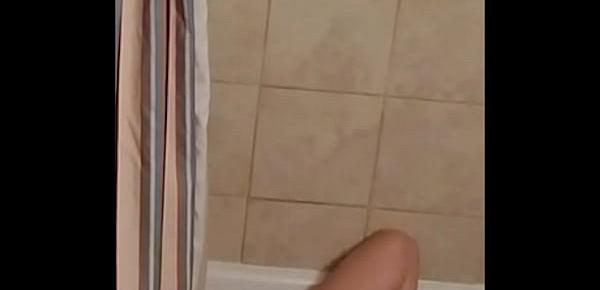  Spying on MILF enjoying a dildo in the bath.